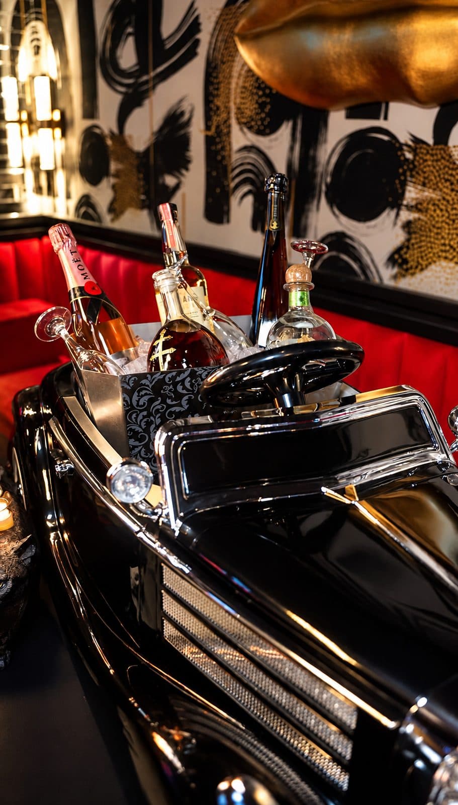 Bottle service on the classic car inside Pizookah Lounge