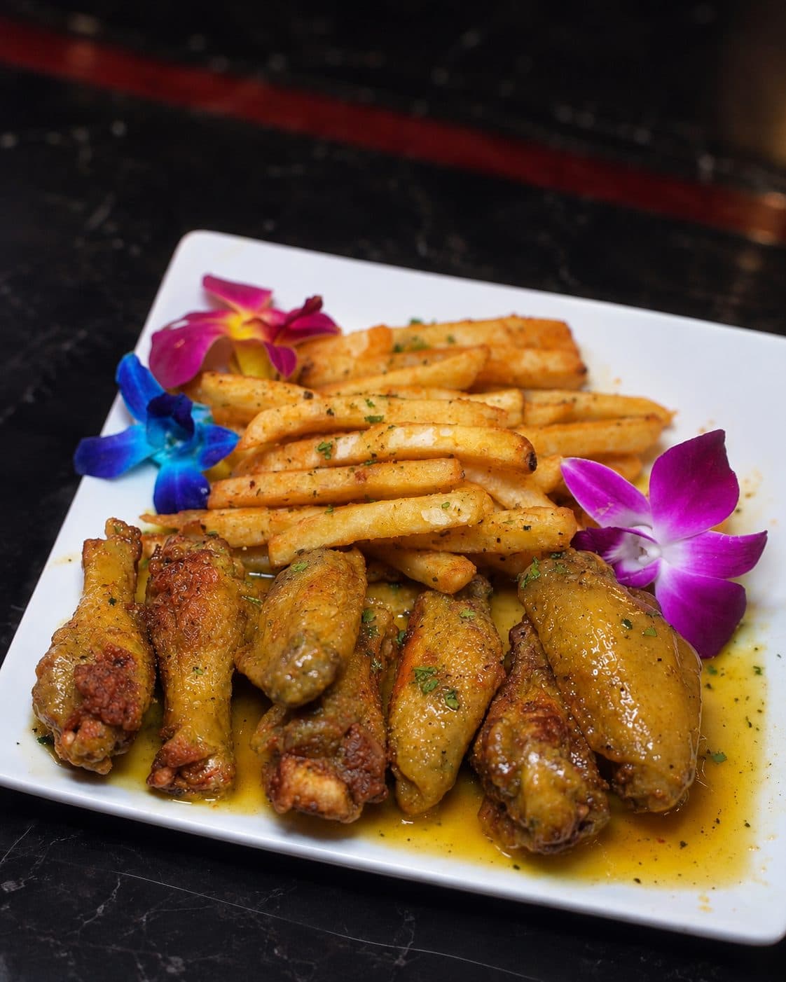 Wet lemon pepper wings with fries